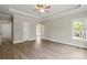 Bright main bedroom with ceiling fan, hardwood floors and ample natural light at 156 Clear Springs Rd, Mooresville, NC 28115
