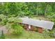 Aerial view of brick home with mature landscaping at 1713 Wildwood Dr, Albemarle, NC 28001