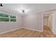 Bedroom with light pink walls, modern floors, and view through the windows at 1713 Wildwood Dr, Albemarle, NC 28001
