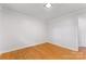 Bright bedroom featuring wood floors and a textured ceiling at 1713 Wildwood Dr, Albemarle, NC 28001