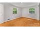 A clean bedroom with wood floors and natural light at 1713 Wildwood Dr, Albemarle, NC 28001