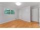 A clean bedroom with wood floors, two closets, and natural light at 1713 Wildwood Dr, Albemarle, NC 28001