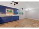 The kitchen is blue and has plenty of room for a dining area at 1713 Wildwood Dr, Albemarle, NC 28001