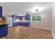 Open kitchen with classic blue cabinets and newer appliances, lots of room for dining at 1713 Wildwood Dr, Albemarle, NC 28001