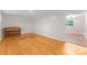 Bright living room with hardwood floors, piano, and entryway to another room at 1713 Wildwood Dr, Albemarle, NC 28001