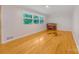 Spacious living room with wood floors and lots of natural light from large windows at 1713 Wildwood Dr, Albemarle, NC 28001