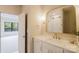 Stylish bathroom with white vanity, marble countertop, gold fixtures, and a framed mirror above the sink at 1807 Arnold Dr, Charlotte, NC 28205