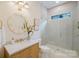 Chic bathroom features a decorative mirror, single vanity, and glass shower, creating a harmonious blend of style and functionality at 1807 Arnold Dr, Charlotte, NC 28205