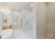 Elegant bathroom showcasing a glass shower and soaking tub, blending modern design with comfort for a spa-like experience at 1807 Arnold Dr, Charlotte, NC 28205