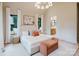 Cozy bedroom with neutral hues, elegant decor, and an ensuite bathroom entrance create a comfortable, private space at 1807 Arnold Dr, Charlotte, NC 28205