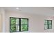 Bright bedroom featuring windows offering views of the lush, green surroundings at 1807 Arnold Dr, Charlotte, NC 28205