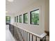 Bright hallway with natural light from multiple windows and wood floors, providing a warm and inviting atmosphere at 1807 Arnold Dr, Charlotte, NC 28205