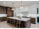 Gourmet kitchen with large center island, counter seating, and stainless steel appliances, perfect for cooking at 1807 Arnold Dr, Charlotte, NC 28205