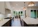 Stylish kitchen featuring modern appliances, a center island, and an open view to the elegant dining area at 1807 Arnold Dr, Charlotte, NC 28205