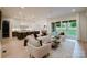 Open-concept living room featuring contemporary furnishings, natural light, and seamless flow to a modern kitchen at 1807 Arnold Dr, Charlotte, NC 28205