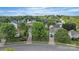 An aerial shot showcases a suburban neighborhood with mature trees and well-maintained lawns at 2008 Taras Trace Dr, Statesville, NC 28625