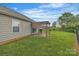 A cozy backyard with a pergola-covered patio, ideal for outdoor relaxing and dining at 2008 Taras Trace Dr, Statesville, NC 28625