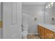 Cozy bathroom with tile flooring, a wood vanity, white toilet, and a bathtub with shower at 2008 Taras Trace Dr, Statesville, NC 28625