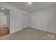 Bedroom featuring neutral walls, plush carpeting, and a closet at 2008 Taras Trace Dr, Statesville, NC 28625