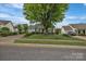 Charming single-story home featuring neat landscaping and a welcoming curb appeal at 2008 Taras Trace Dr, Statesville, NC 28625