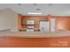 Functional kitchen layout with appliances and a view of breakfast bar and dining space at 2008 Taras Trace Dr, Statesville, NC 28625