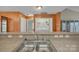 A laundry area is shown with appliances next to a utility sink and extra cabinet space at 2008 Taras Trace Dr, Statesville, NC 28625