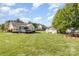 Expansive backyard featuring a shed, swing set, and large grassy area, perfect for outdoor activities at 206 Summey Barker Dr, Dallas, NC 28034