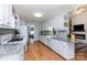 Spacious kitchen boasting white cabinets, granite countertops, and hardwood floors at 206 Summey Barker Dr, Dallas, NC 28034