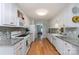 Bright kitchen featuring white cabinets, granite countertops, and modern appliances at 206 Summey Barker Dr, Dallas, NC 28034