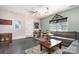 Spacious living room features a gray sofa, a wooden coffee table, and large windows at 206 Summey Barker Dr, Dallas, NC 28034