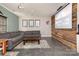 Spacious living area with gray sectional sofa, wooden coffee table, and a projector screen at 206 Summey Barker Dr, Dallas, NC 28034