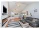 Bright living room with vaulted ceilings, modern fireplace, and hardwood floors at 206 Summey Barker Dr, Dallas, NC 28034
