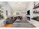Cozy living room featuring a fireplace, hardwood floors, and stylish decor at 206 Summey Barker Dr, Dallas, NC 28034