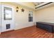 Cozy covered porch featuring wood floors, neutral siding, and a charming star decoration at 206 Summey Barker Dr, Dallas, NC 28034