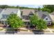 Aerial view of a well-maintained home with mature trees in a serene neighborhood setting with surrounding homes at 209 Helton Ln, Fort Mill, SC 29708