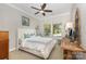 Bright bedroom with a ceiling fan, two windows and a comfortable queen sized bed at 209 Helton Ln, Fort Mill, SC 29708
