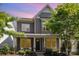 Charming two-story home featuring a welcoming front porch, landscaped yard, and elegant gray siding at 209 Helton Ln, Fort Mill, SC 29708