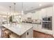 Modern kitchen featuring granite countertops, stainless steel appliances, and an open view to the dining area at 209 Helton Ln, Fort Mill, SC 29708