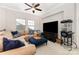 Cozy upstairs living space with comfortable seating, a ceiling fan, large TV and popcorn machine at 209 Helton Ln, Fort Mill, SC 29708