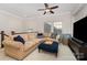 Upstairs living space with comfortable seating, ceiling fan, large TV and a popcorn machine at 209 Helton Ln, Fort Mill, SC 29708