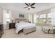 Spacious main bedroom featuring a ceiling fan, large windows, and a neutral color palette at 209 Helton Ln, Fort Mill, SC 29708