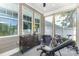 Screened porch with exercise equipment and ceiling fan at 209 Helton Ln, Fort Mill, SC 29708