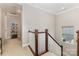 Carpeted staircase with stained wood railing leading to the upper level of the home at 209 Helton Ln, Fort Mill, SC 29708
