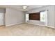 This cozy bedroom features neutral walls, carpet flooring, and bright natural light from the windows at 2369 Baxter Se Pl, Concord, NC 28025