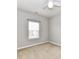 Bright bedroom features neutral walls, carpet flooring, and a window for natural light at 2369 Baxter Se Pl, Concord, NC 28025
