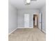 A neutral bedroom with carpet flooring, a ceiling fan and two doors exiting the room at 2369 Baxter Se Pl, Concord, NC 28025