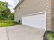 Attached two car garage offers convenient parking and access to the home at 2369 Baxter Se Pl, Concord, NC 28025