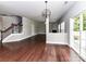 The living room features hardwood floors and connects to a stairway and another seating area at 2369 Baxter Se Pl, Concord, NC 28025