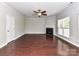 Spacious living room with hardwood floors, fireplace, and neutral color palette at 2369 Baxter Se Pl, Concord, NC 28025