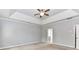 Relax in this spacious main bedroom with trey ceiling, ceiling fan and ensuite bathroom at 2369 Baxter Se Pl, Concord, NC 28025
